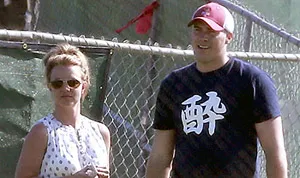 1363458627_britney spears david lucado golfing 300