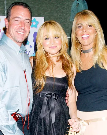 1367779669_76047159_lindsay lohan dina lohan michael lohan 350
