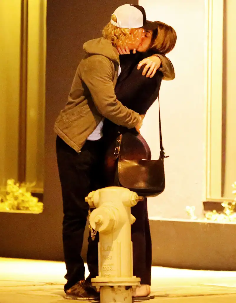 Owen Wilson and a woman kiss on October 7, 2013 in in Santa Monica