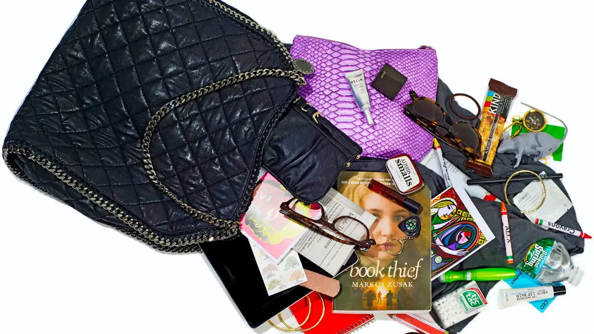 Bridget Moynahan, 42, empties our her purse for Us.