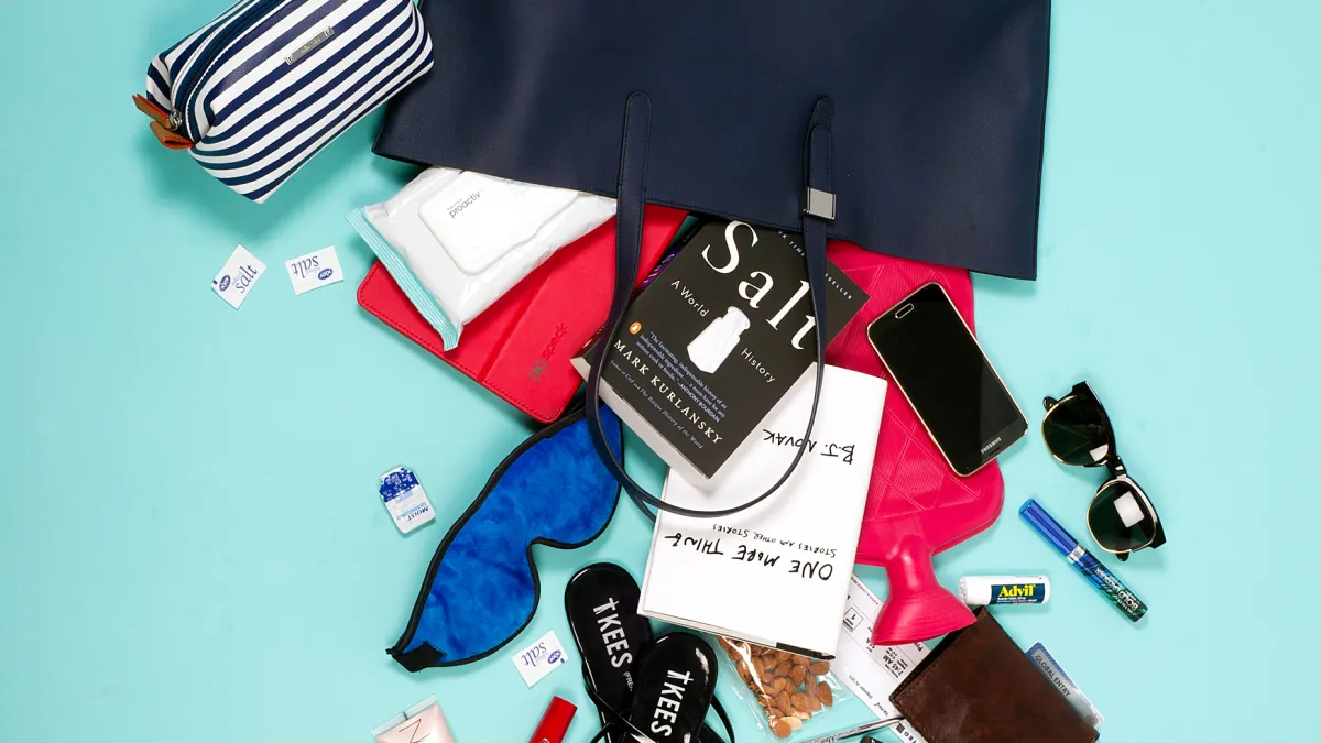 Olivia Munn pours out her tote for Luxury Handbag Shopping.