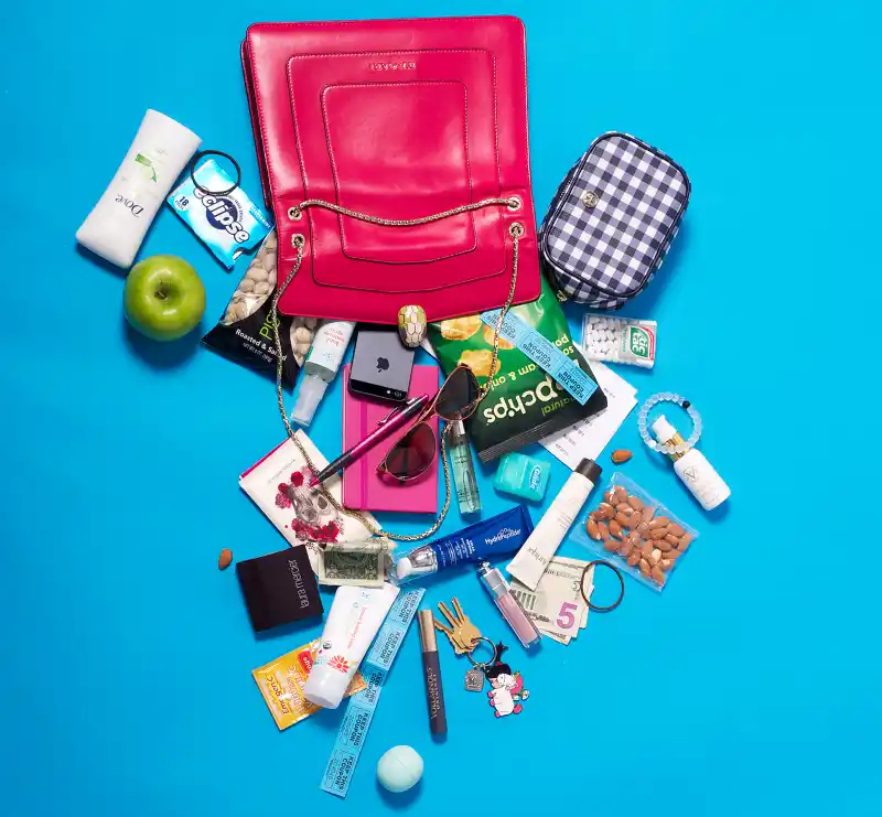 Ashley Greene pours out her satchel for Luxury Handbag Shopping.