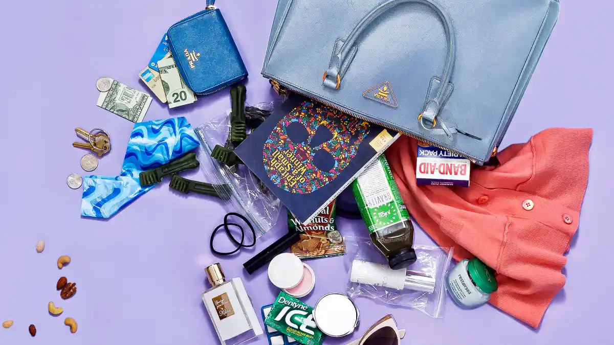 Famke Janssen spills her purse for Luxury Handbag Shopping.