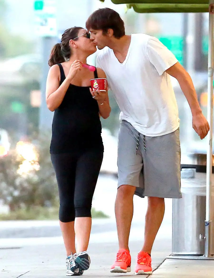 1407961558_mila kunis ashton kutcher kiss froyo zoom