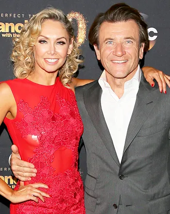 1426617304_466572104_kym johnson robert herjavec 350