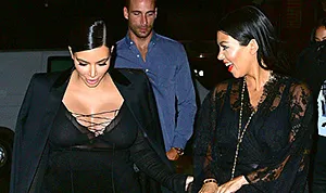 1442414001_kim kardashian kourtney kardashian 300
