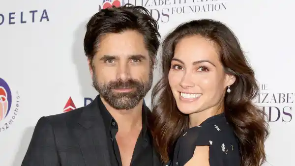 John Stamos (L) and Caitlin McHugh