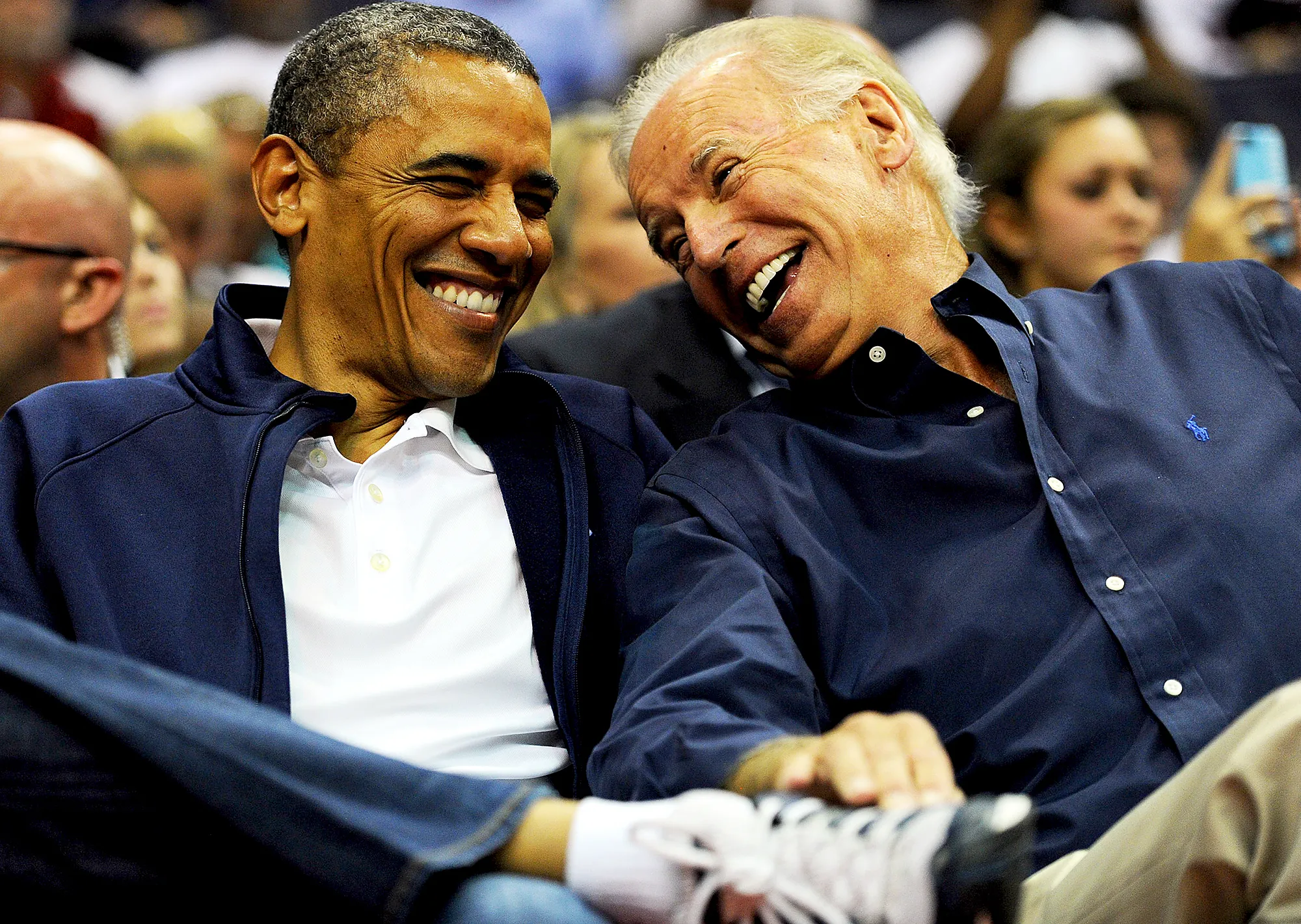 Barack Obama and Joe Biden attend the pre-Olympic exhibition basketball game at the Verizon Center on July 16, 2012 in Washington, DC.