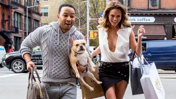 John Legend and Chrissy Teigen with their dog during a photo shoot in New York City.