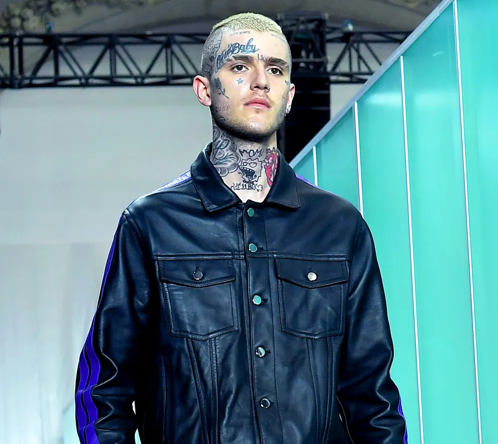 Lil Peep walks the runway during the Vlone Menswear Spring/Summer 2018 show as part of Paris Fashion Week on June 23, 2017 in Paris, France.