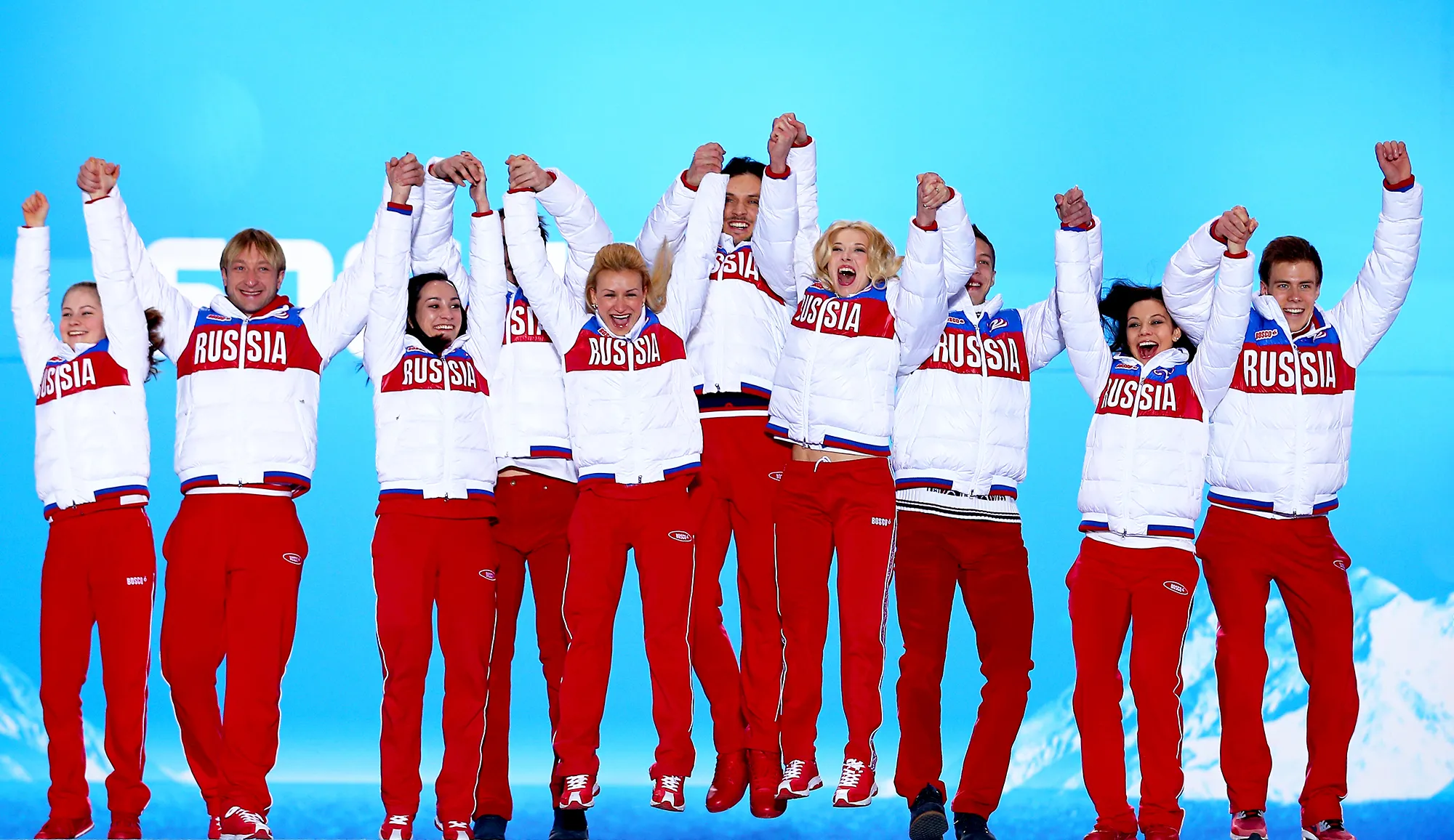 Russian team celebrate during the medal ceremony during the Sochi 2014 Winter Olympics in Sochi, Russia.