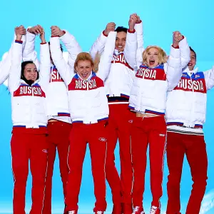 Russian team celebrate during the medal ceremony during the Sochi 2014 Winter Olympics in Sochi, Russia.
