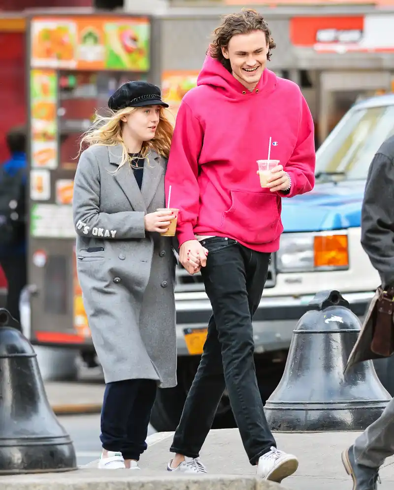 Dakota Fanning and Henry Frye holding hands