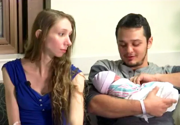 Tiffani Von Glahn and Carl Alewine with their baby girl