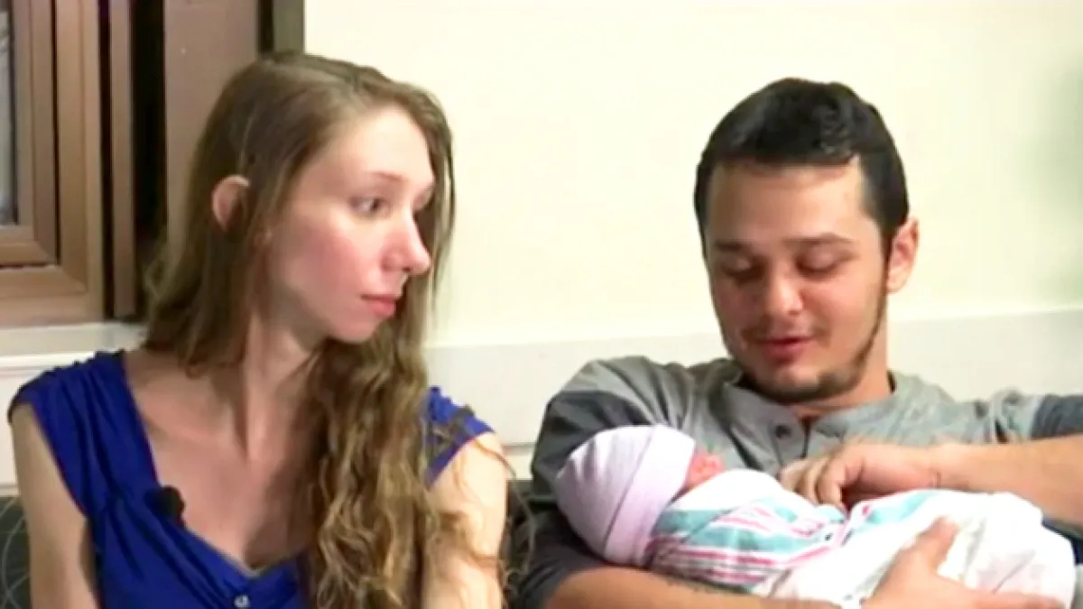 Tiffani Von Glahn and Carl Alewine with their baby girl