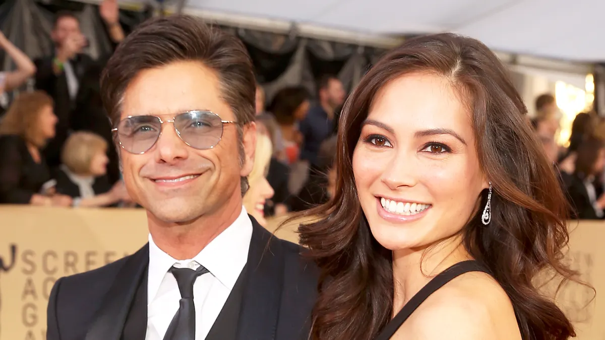 John Stamos and Caitlin McHugh attend the 24th Annual Screen Actors Guild Awards at The Shrine Auditorium in Los Angeles, California.