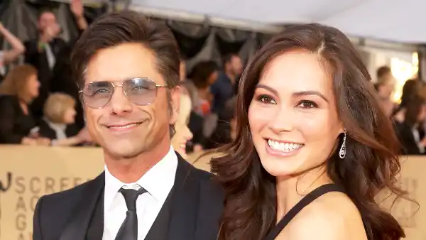 John Stamos and Caitlin McHugh attend the 24th Annual Screen Actors Guild Awards at The Shrine Auditorium in Los Angeles, California.