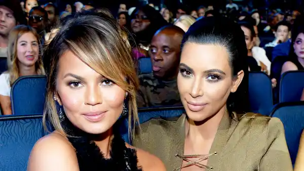 Chrissy Teigen and Kim Kardashian attend the 2015 MTV Video Music Awards at Microsoft Theater in Los Angeles, California.