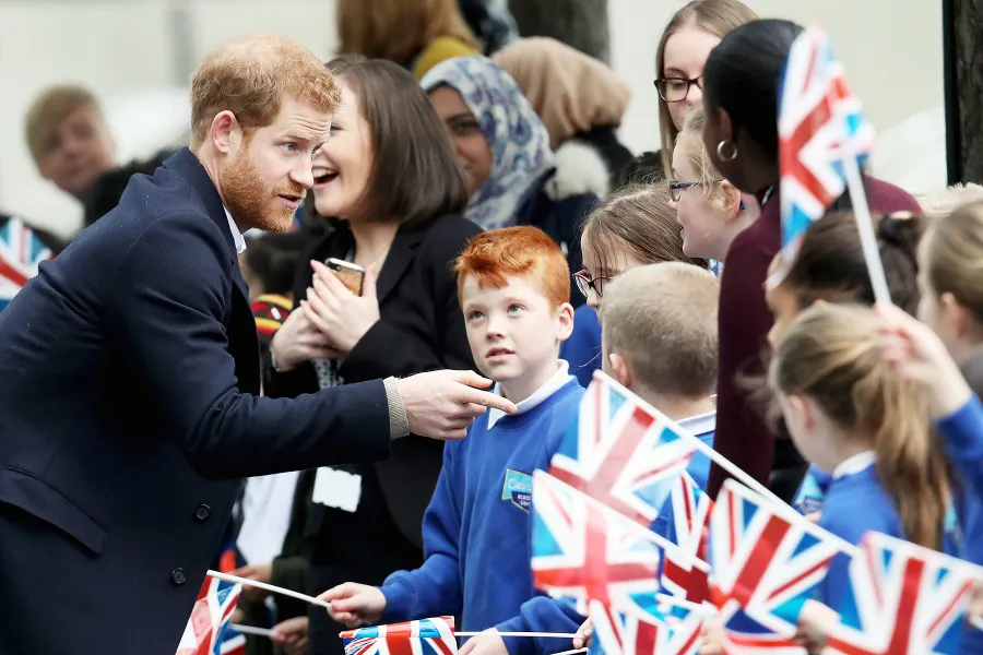 Prince Harry and Meghan Markle Hug Kids at Royal Engagement