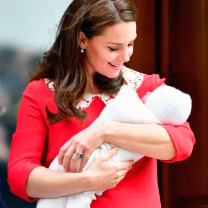 Kate Middleton looks at Prince Louis of Cambridge on the steps of the Lindo Wing at St Mary's Hospital in London, England on April 23, 2018.