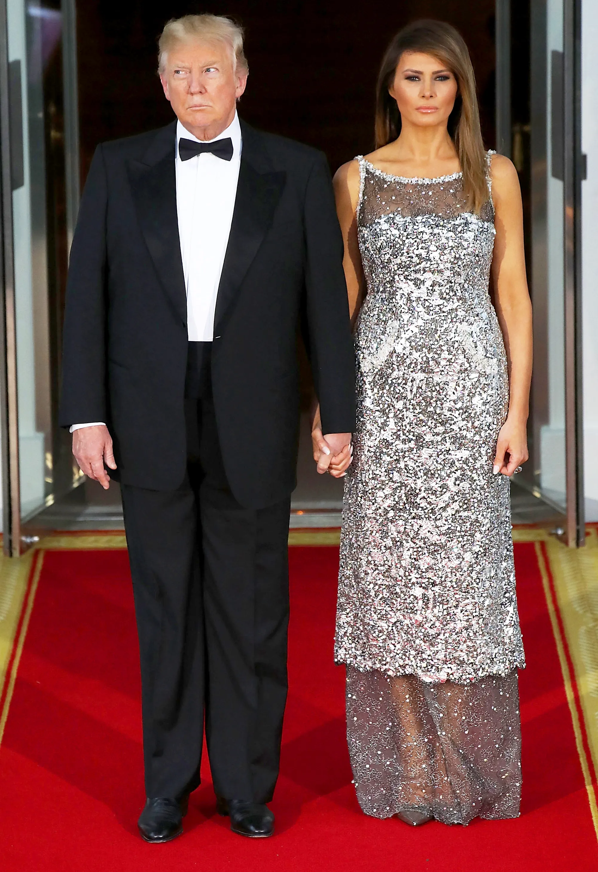 Donald Trump and Melania Trump wait for the arrival of French President Emmanuel Macron, French first lady Brigitte Macron at the North Portico for before a State Dinner at the White House April 24, 2018 in Washington, DC.
