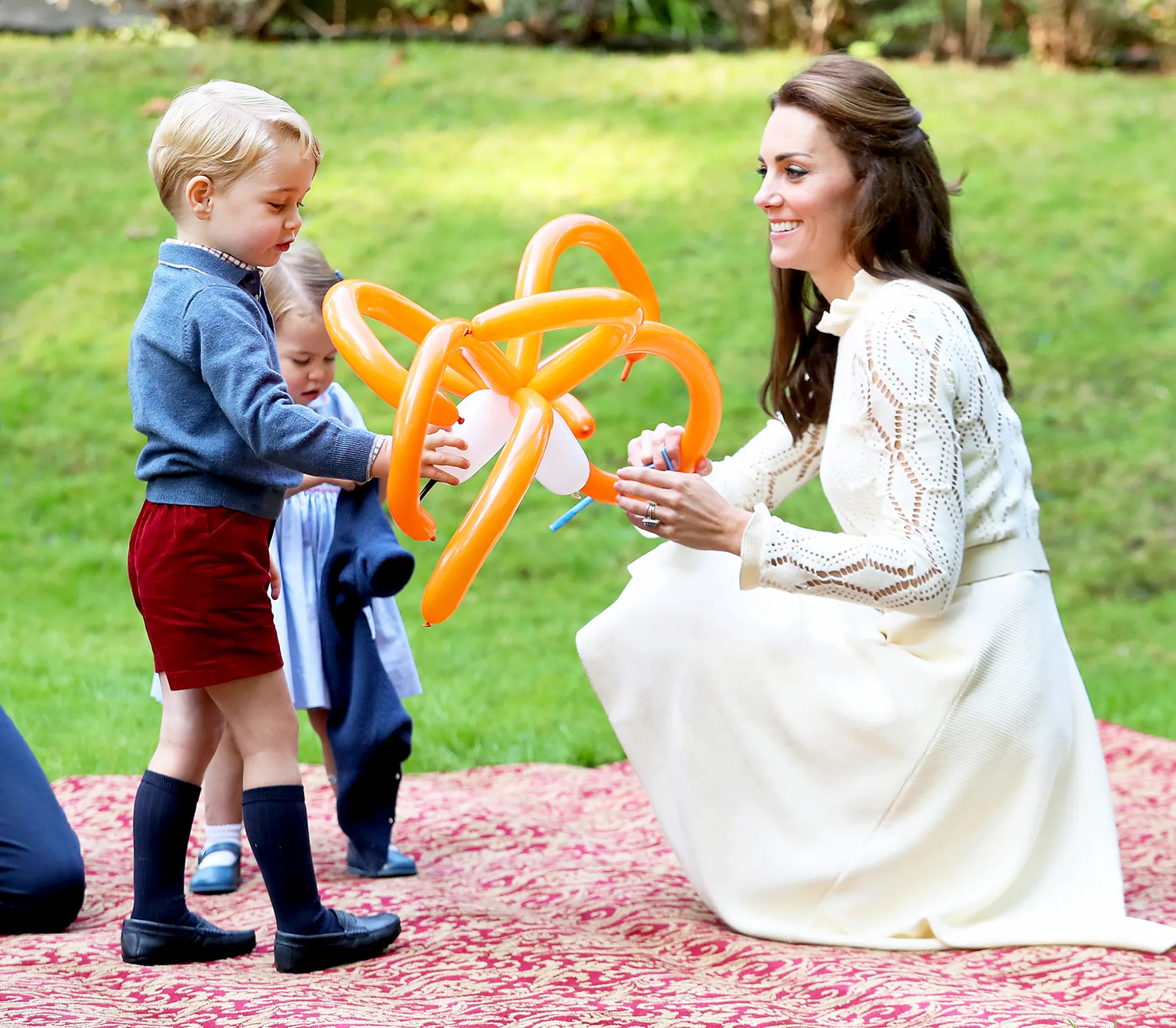 Kate Middleton with Princess Charlotte and Prince George at a children's party for Military families during the 2016 Royal Tour of Canada in Victoria, Canada.
