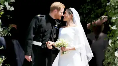 Prince Harry and Meghan Markle leave St George's Chapel after their wedding in St George's Chapel at Windsor Castle on May 19, 2018 in Windsor, England.