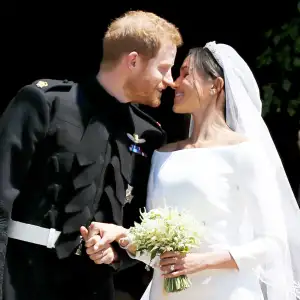 Prince Harry and Meghan Markle leave St George's Chapel after their wedding in St George's Chapel at Windsor Castle on May 19, 2018 in Windsor, England.