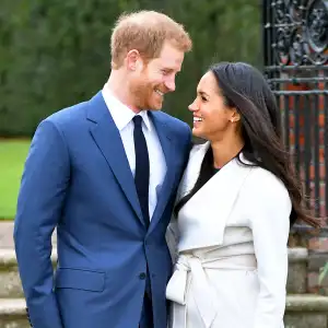 Prince Harry and Meghan Markle during an official photocall to announce their engagement at The Sunken Gardens at Kensington Palace on November 27, 2017 in London, England.