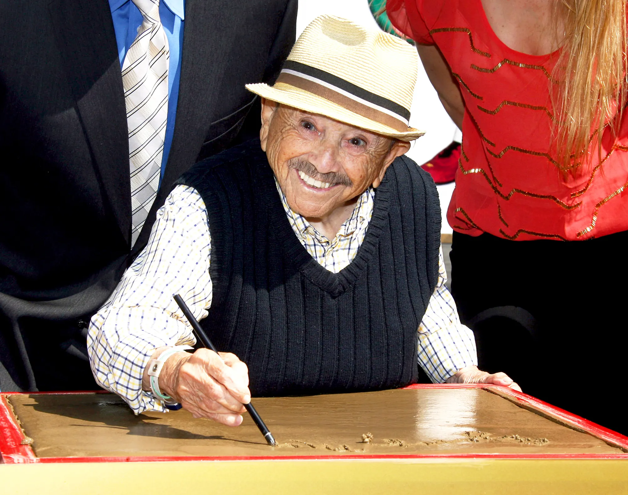Jerry Maren attends the handprint-footprint ceremony for "The Lollipop Kid" last of the Munchkins from "The Wizard Of Oz" the at TCL Chinese Theatre Imax in Hollywood, California.