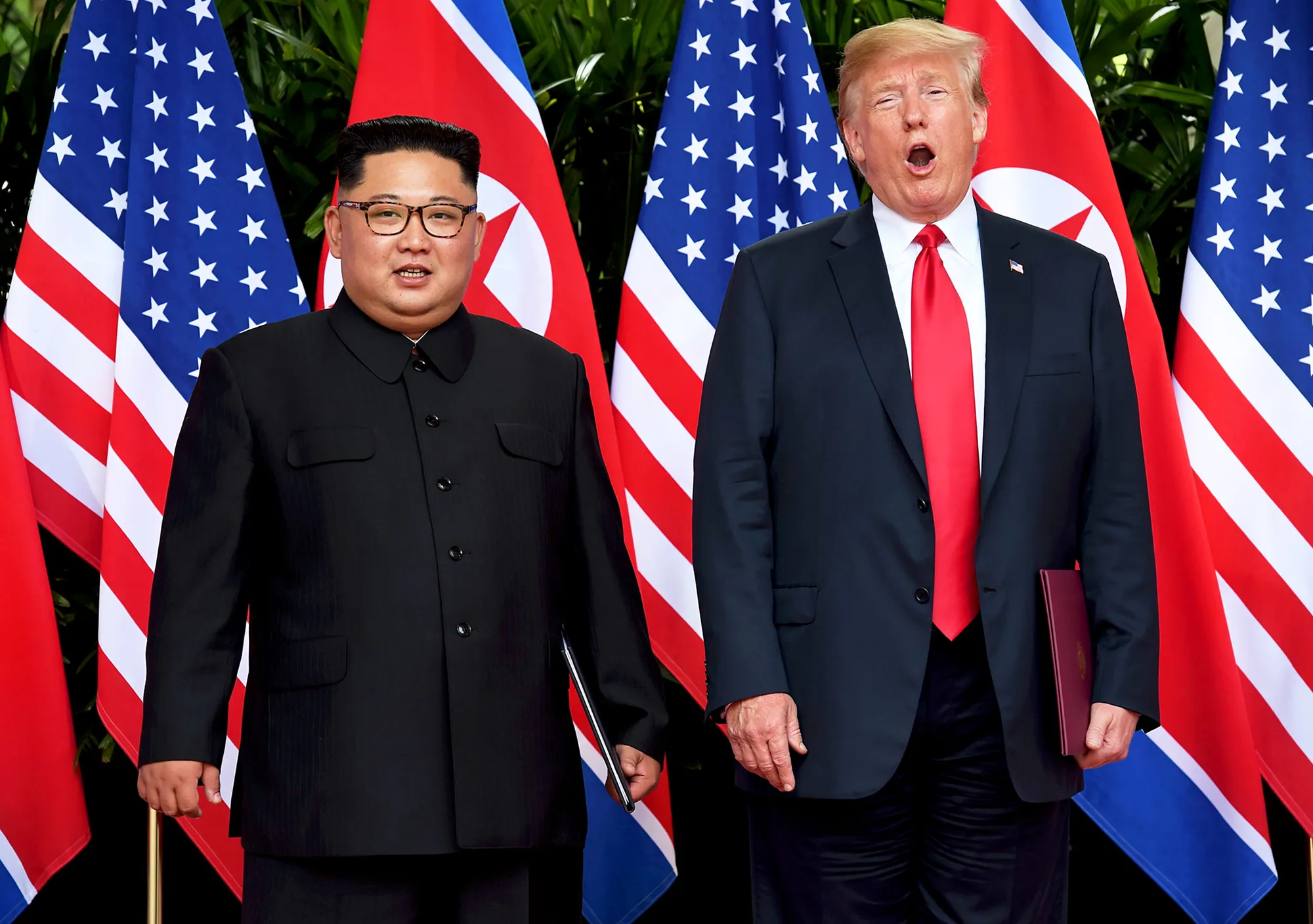 Kim Jong Un and Donald Trump after taking part in a signing ceremony at the end of their historic U.S.-North Korea summit at the Capella Hotel on Sentosa island in Singapore on June 12, 2018.