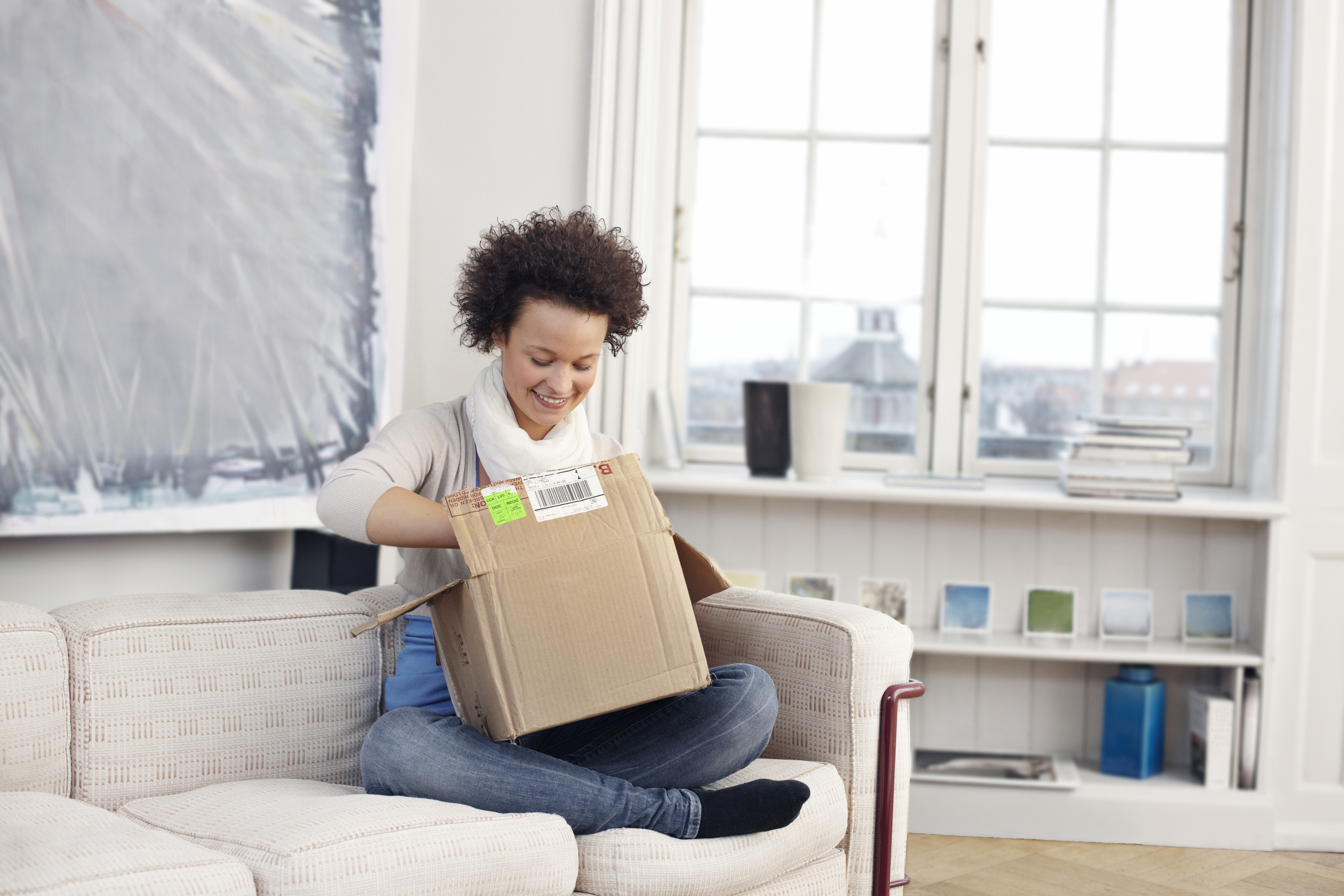 Woman opening box