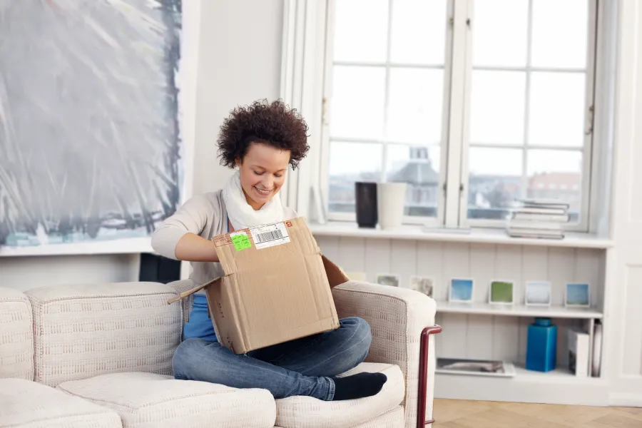 Woman opening box