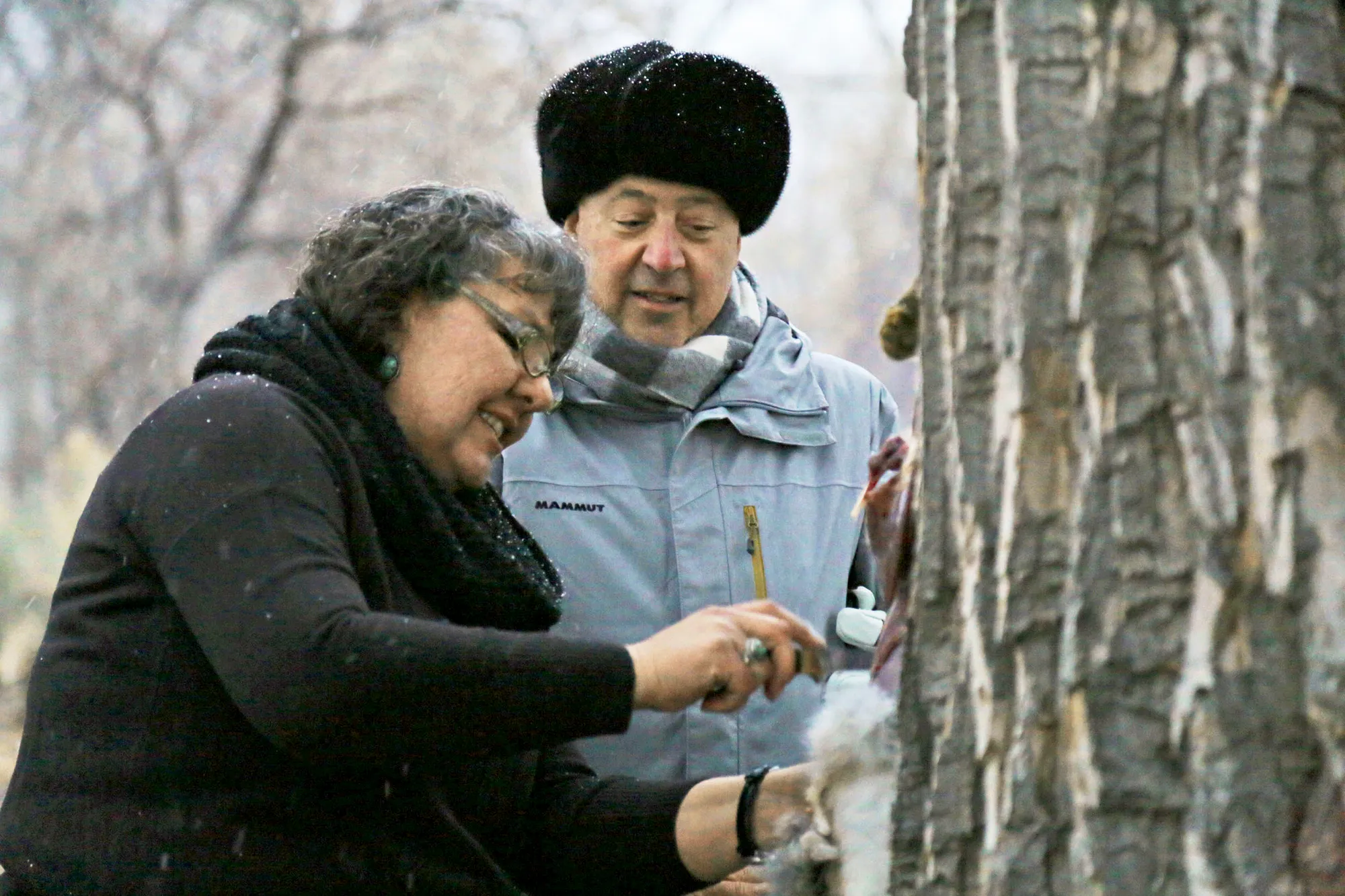Andrew Zimmern watches Donna Cossette skin a wild jackrabbit in preparation for a native Paiute meal near the Pony Express Trail in western Nevada.