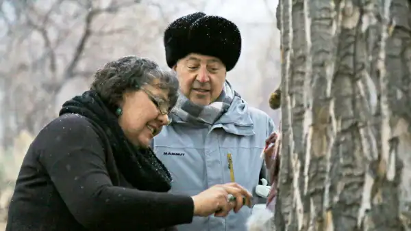 Andrew Zimmern watches Donna Cossette skin a wild jackrabbit in preparation for a native Paiute meal near the Pony Express Trail in western Nevada.