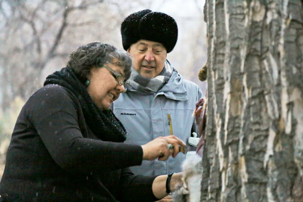 Andrew Zimmern watches Donna Cossette skin a wild jackrabbit in preparation for a native Paiute meal near the Pony Express Trail in western Nevada.