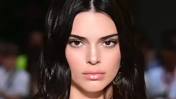 US model Kendall Jenner presents a creation by Versace during the men & women's spring/summer 2019 collection fashion show in Milan, on June 16, 2018. (Photo by MIGUEL MEDINA / AFP) (Photo credit should read MIGUEL MEDINA/AFP/Getty Images)