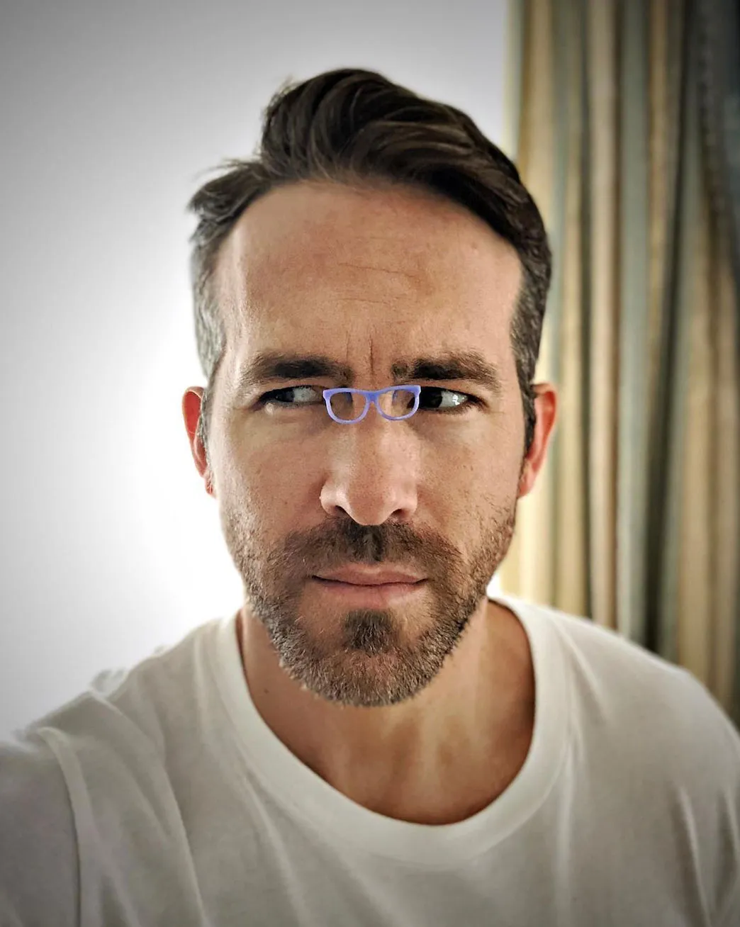 Ryan Reynolds tiny glasses