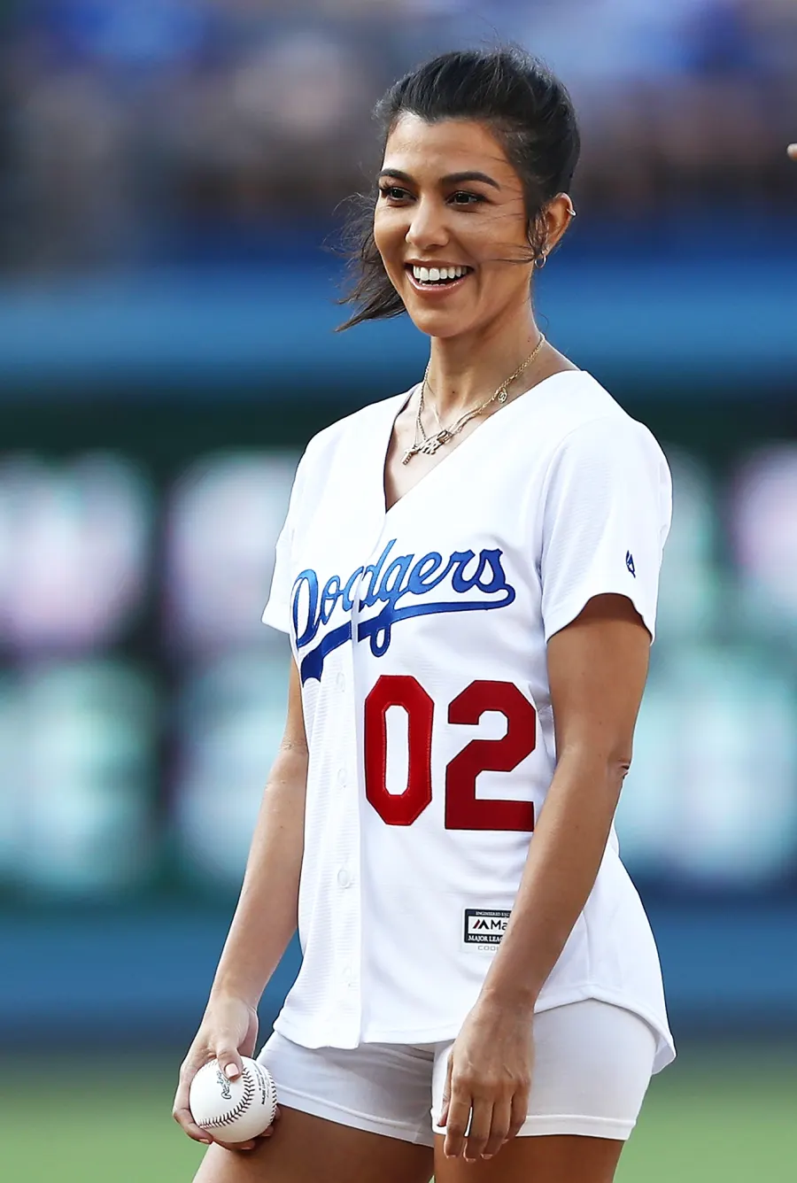 Kourtney Kardashian throws out the ceremonial first pitch prior to the MLB game at Dodger Stadium.