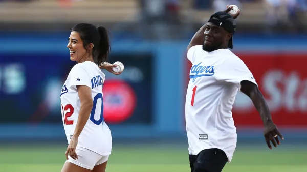 Kourtney Kardashian throws out the ceremonial first pitch prior to the MLB game at Dodger Stadium.