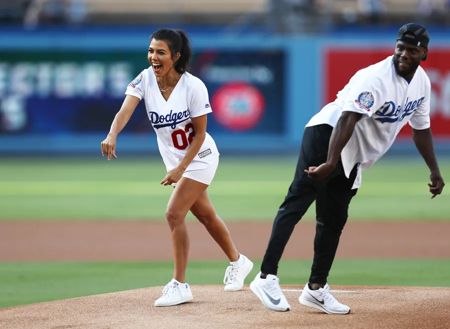 Kourtney Kardashian throws out the ceremonial first pitch prior to the MLB game at Dodger Stadium.
