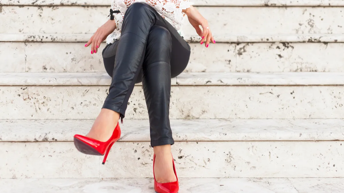 Lady with red high heel shoes