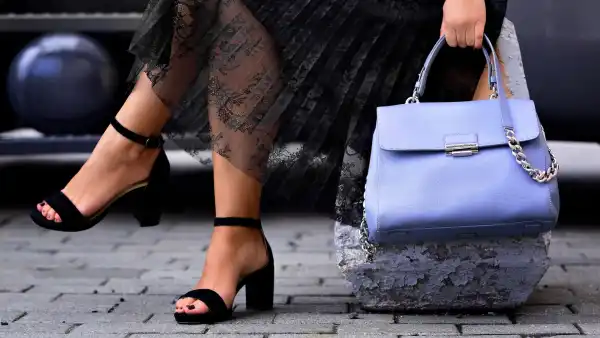 Woman placing bag on the floor