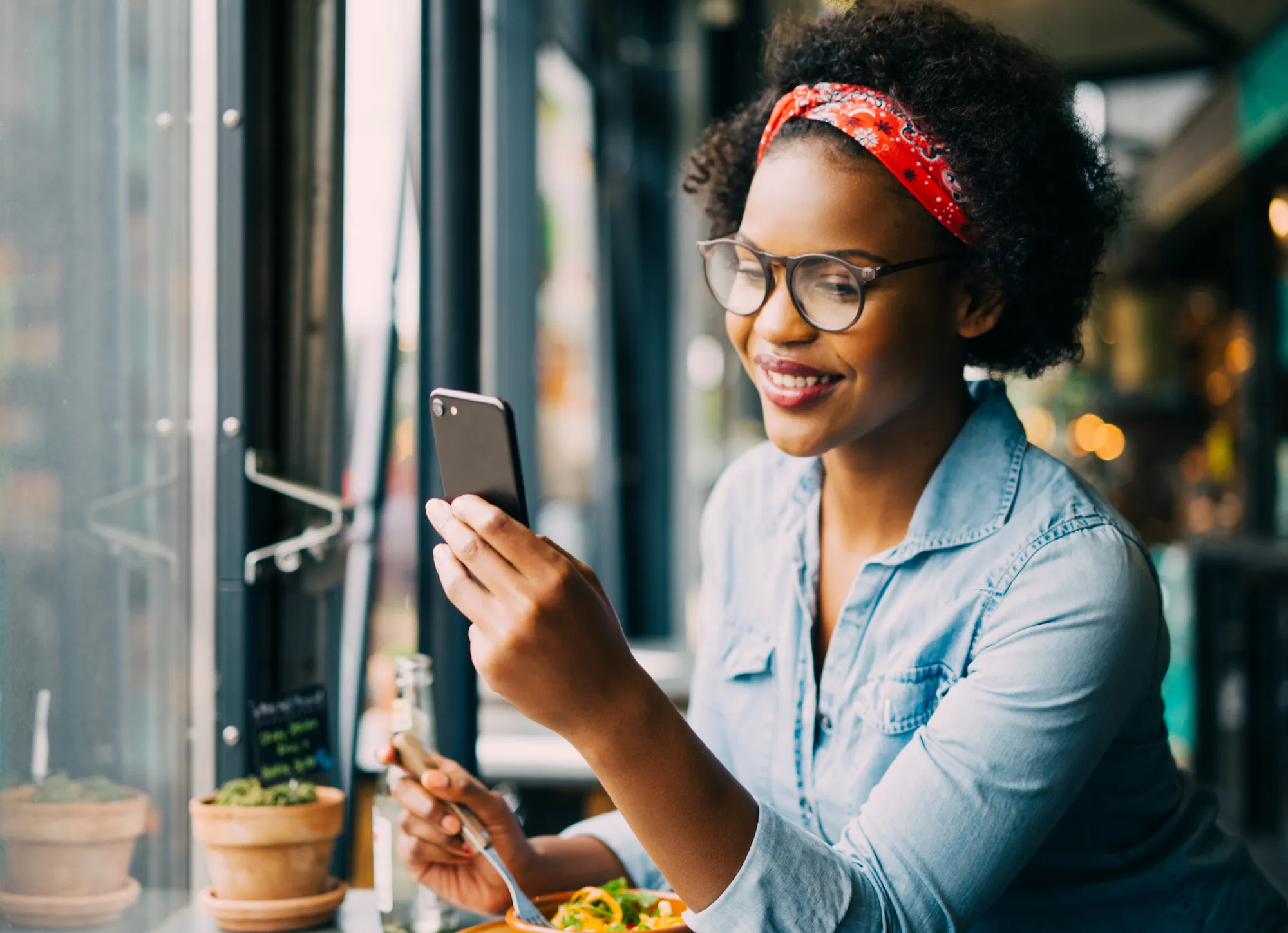 Woman on the phone in cafe