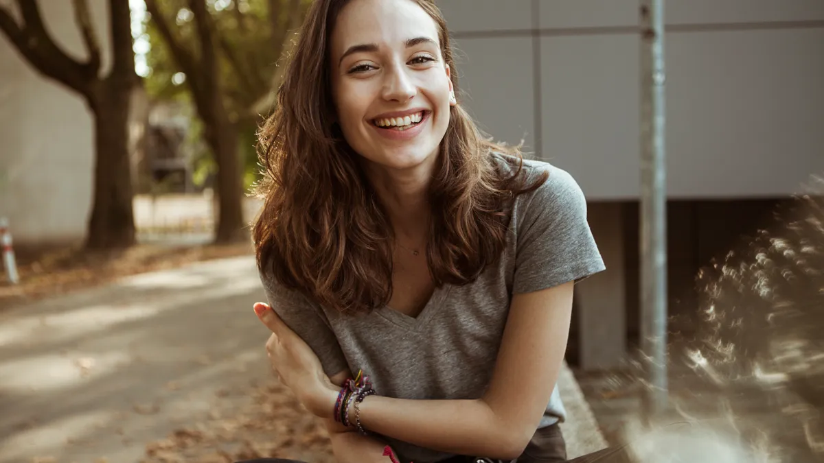Portrait of happy young woman outdoors
