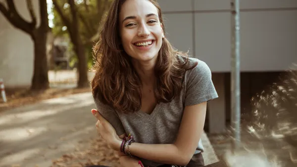 Portrait of happy young woman outdoors