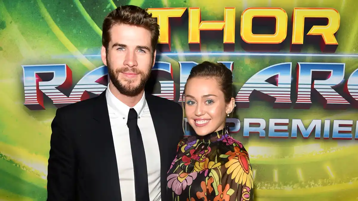 Liam Hemsworth (L) and Miley Cyrus