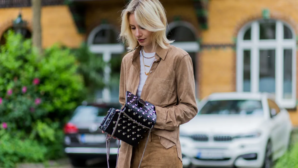 woman in suede pants