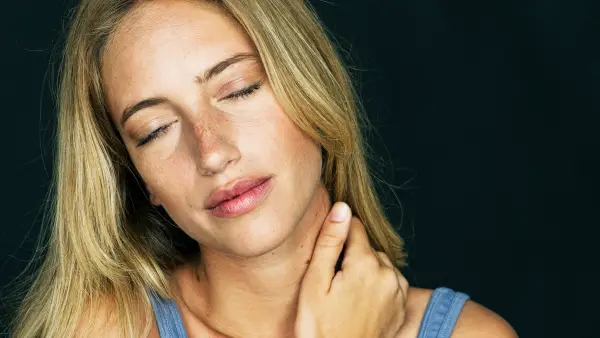 Woman massaging her neck