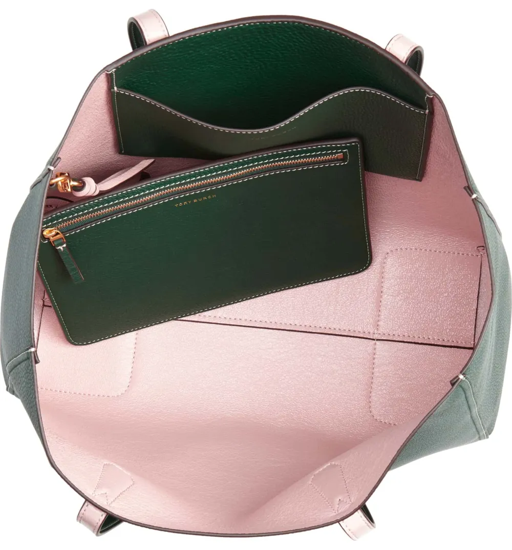 green tory burch tote with light pink interior